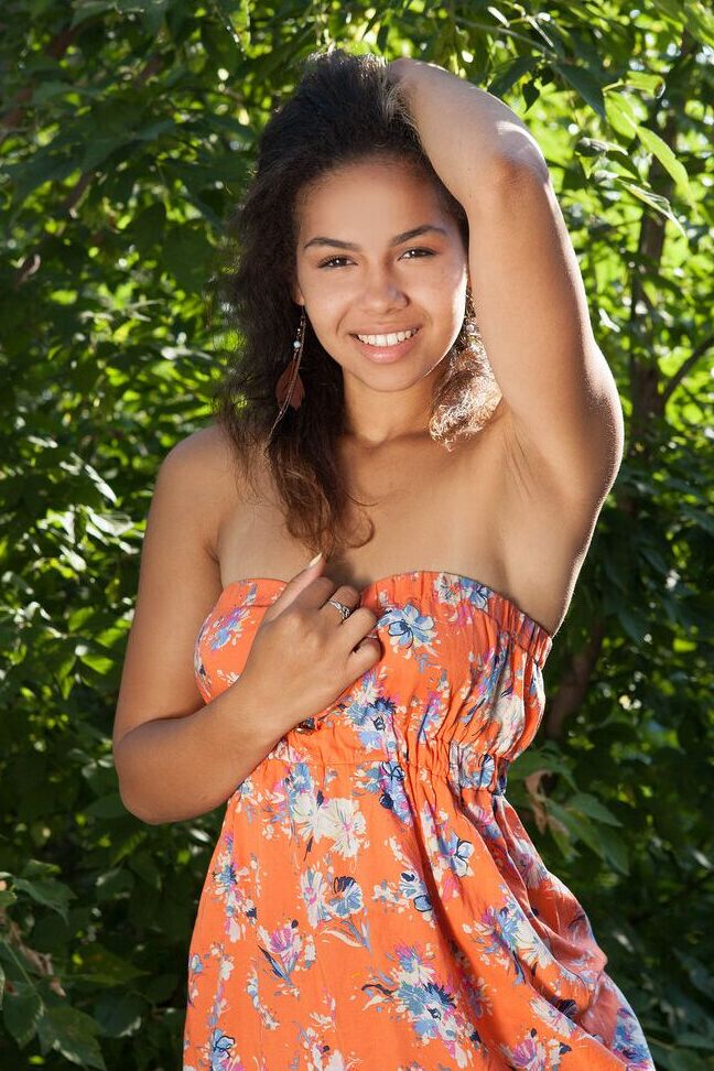 16P Sexy teen Sara performs a striptease to get naked afore forest undergrowth