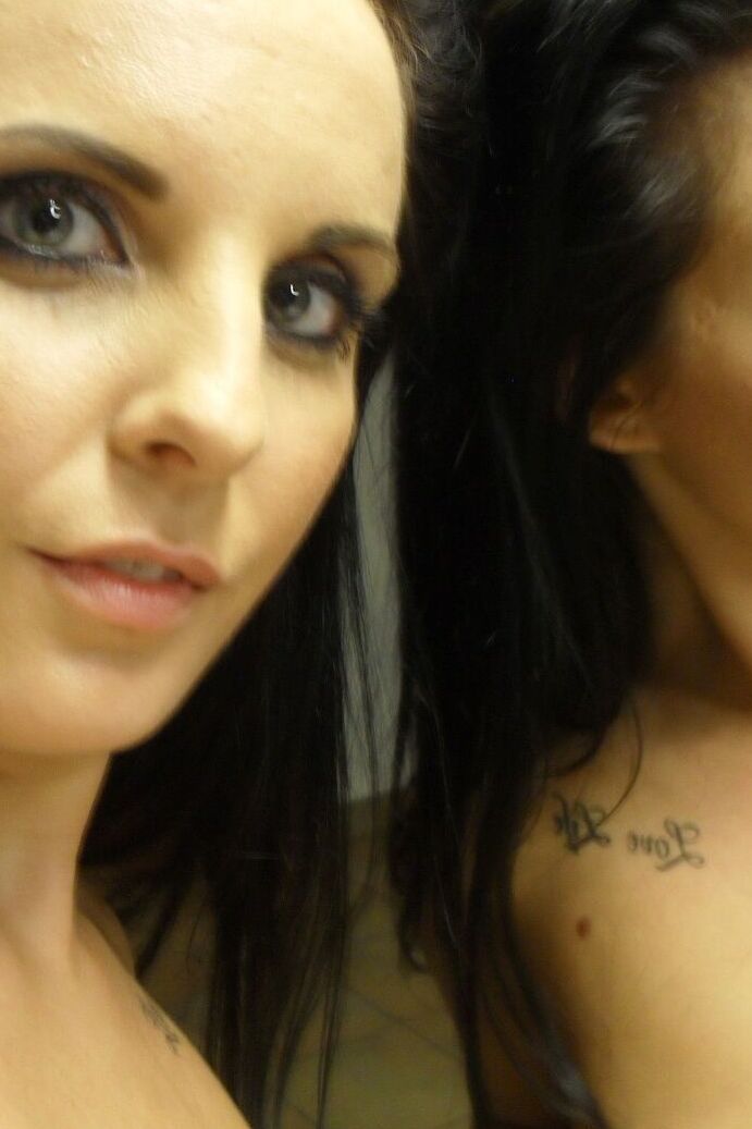 21P Sweet black haired babe Tara Tattoo strips and poses in front of a mirror