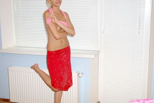 15P Laura in red skirt stripping in front of window blinds