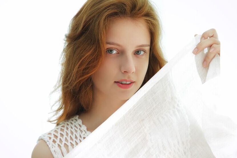 18P Young redhead Sienna puts the focus on her bald cunt after getting naked