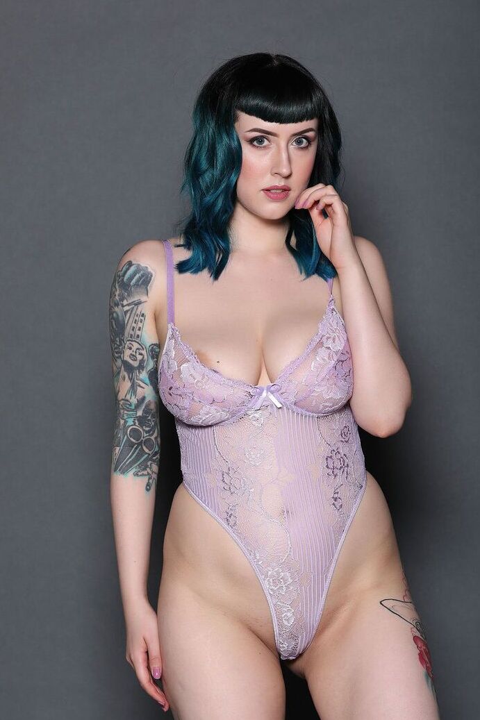 21P Fatty model Lisha Blackhurst displays her inked curves and big juggs & strips