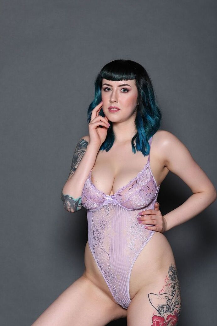 21P Fatty model Lisha Blackhurst displays her inked curves and big juggs & strips