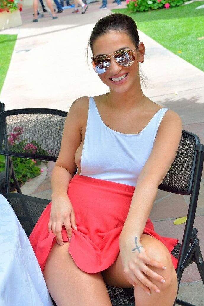 15P Clothed girl teases at an outdoor convention with nip slip and panty upskirts