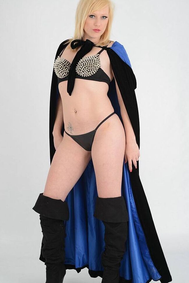 15P Fair skinned blonde Axajay goes topless in a thong and over the knee boots