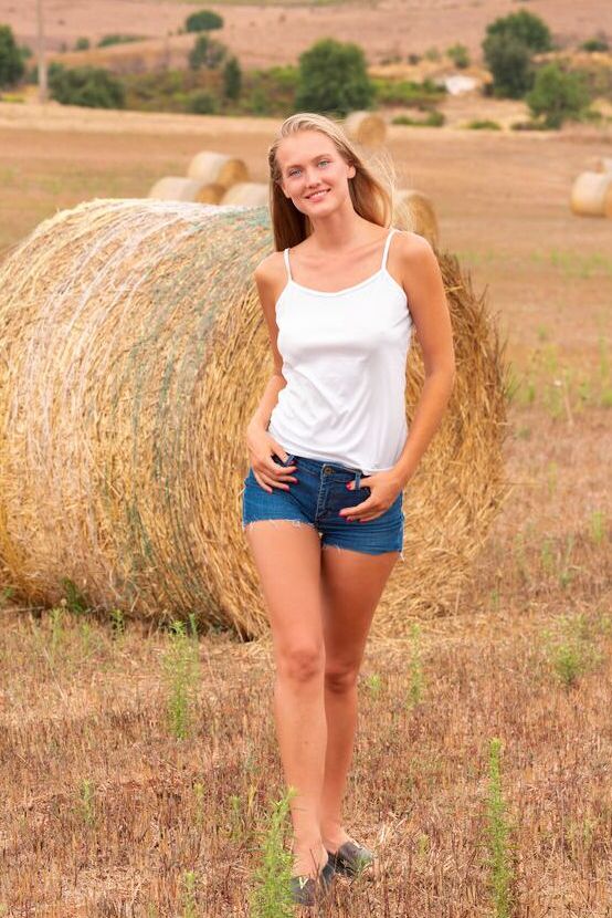 18P Stunning new model Dahlia Svensson divests her white tank top and denim shorts