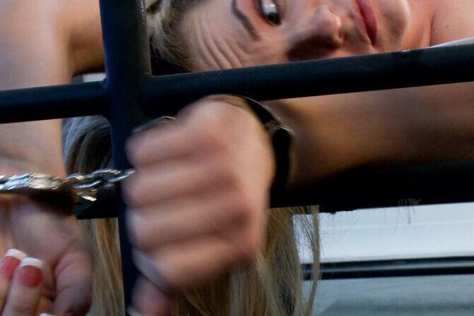 15P Submissive blonde is chained to a bed frame during kinky lezdom play
