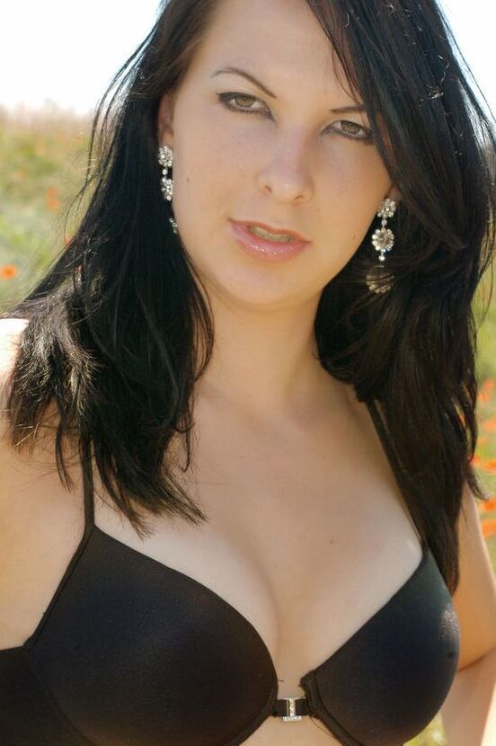 16P Katrine E in the middle of forest seductively poses to exhibit her curves