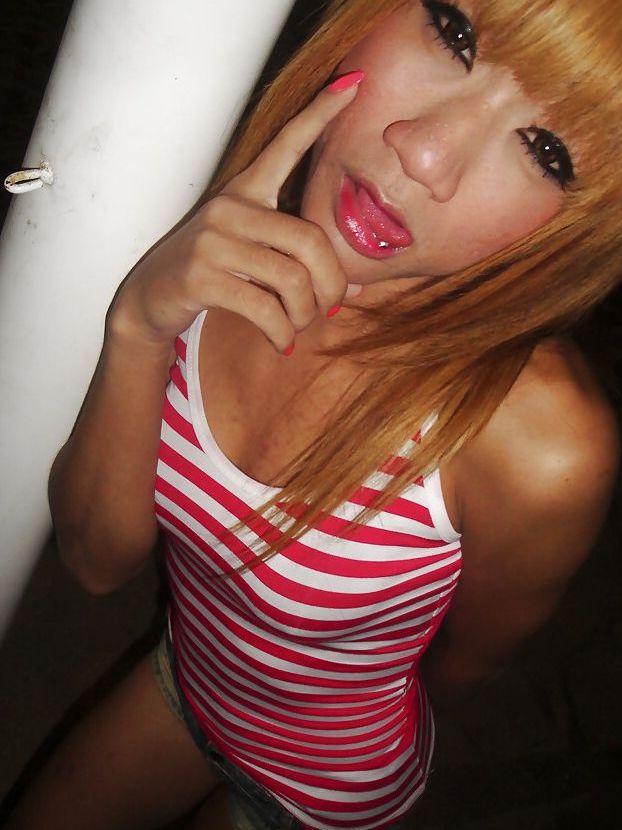 16P Cute redhead Thai ladyboy Nan posing and playing with her small cock
