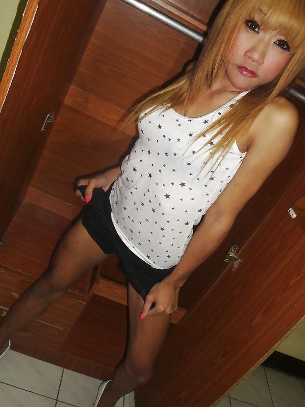16P Cute redhead Thai ladyboy Nan posing and playing with her small cock