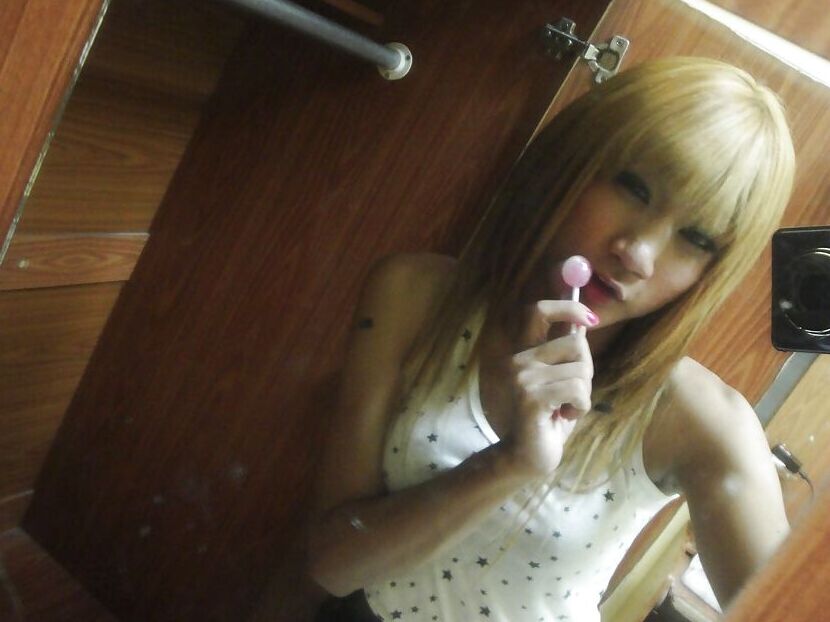 16P Cute redhead Thai ladyboy Nan posing and playing with her small cock