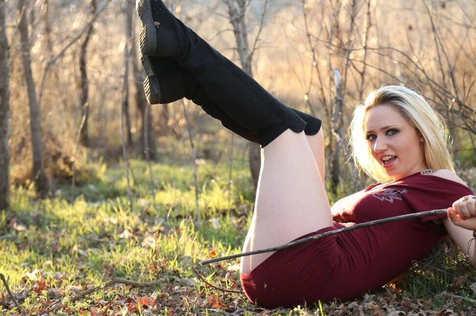 15P Tattooed blonde Lily Xo slides panties aside on a hill in late Spring