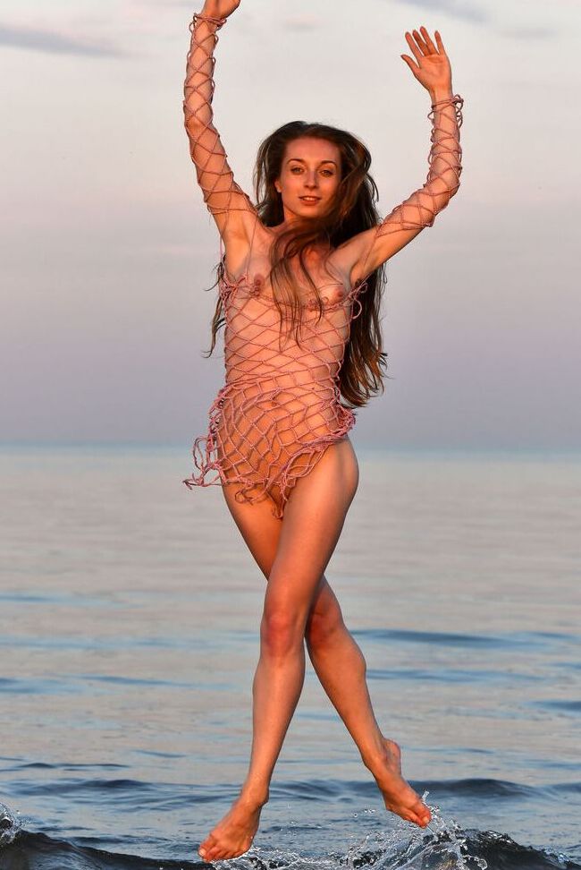 16P Totally naked girl Leanne J displays her athletic abilities in the ocean