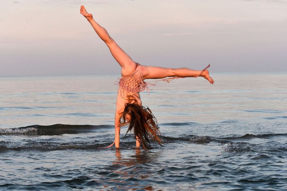 16P Totally naked girl Leanne J displays her athletic abilities in the ocean