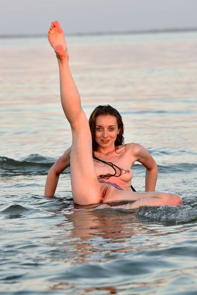 16P Totally naked girl Leanne J displays her athletic abilities in the ocean