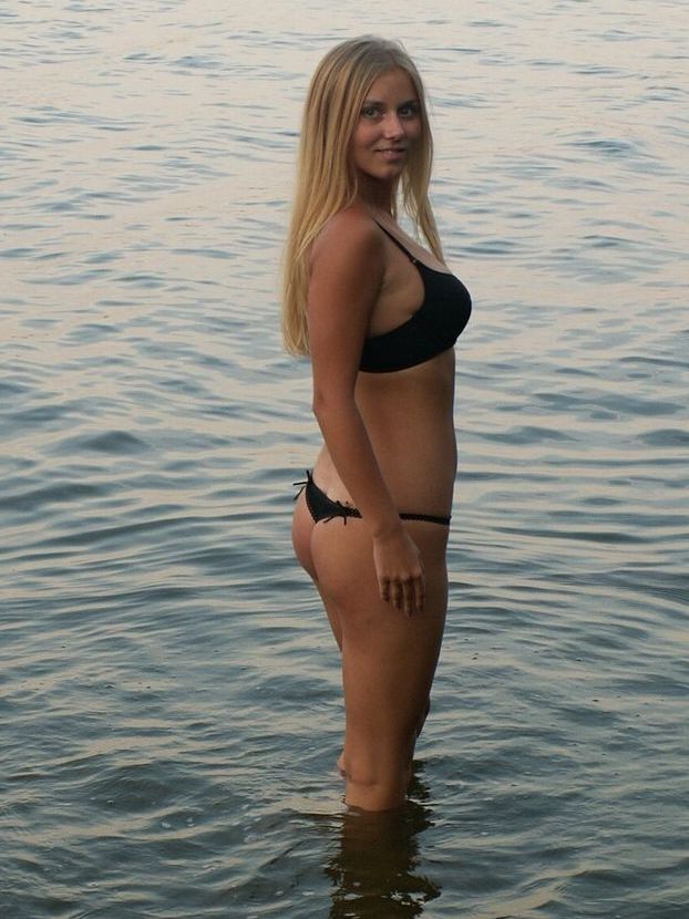 16P Blonde teen eats an apple from the tree after getting naked in the lake