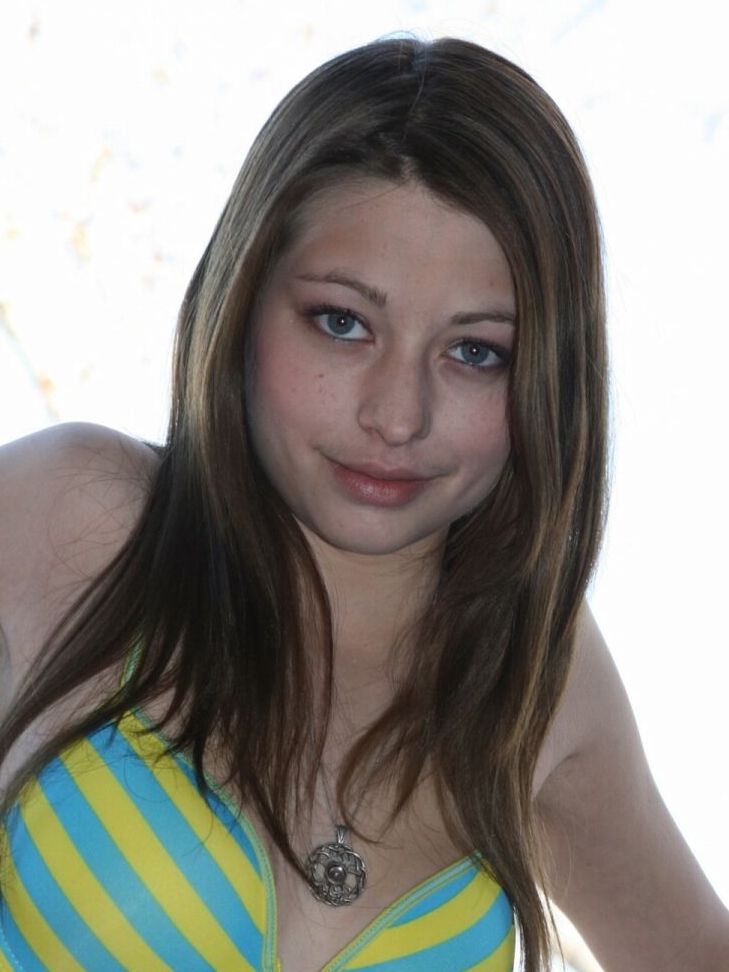15P Amateur girl models a bra and panty ensemble on a condo balcony