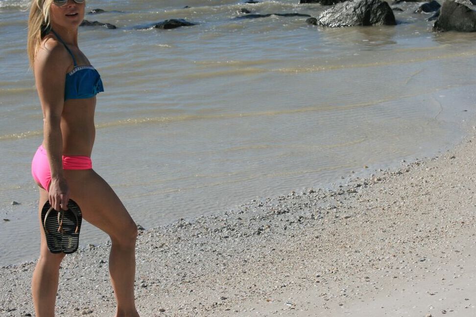 15P Blond amateur Meet Madden goes for a walk on the beach and boardwalk in bikini