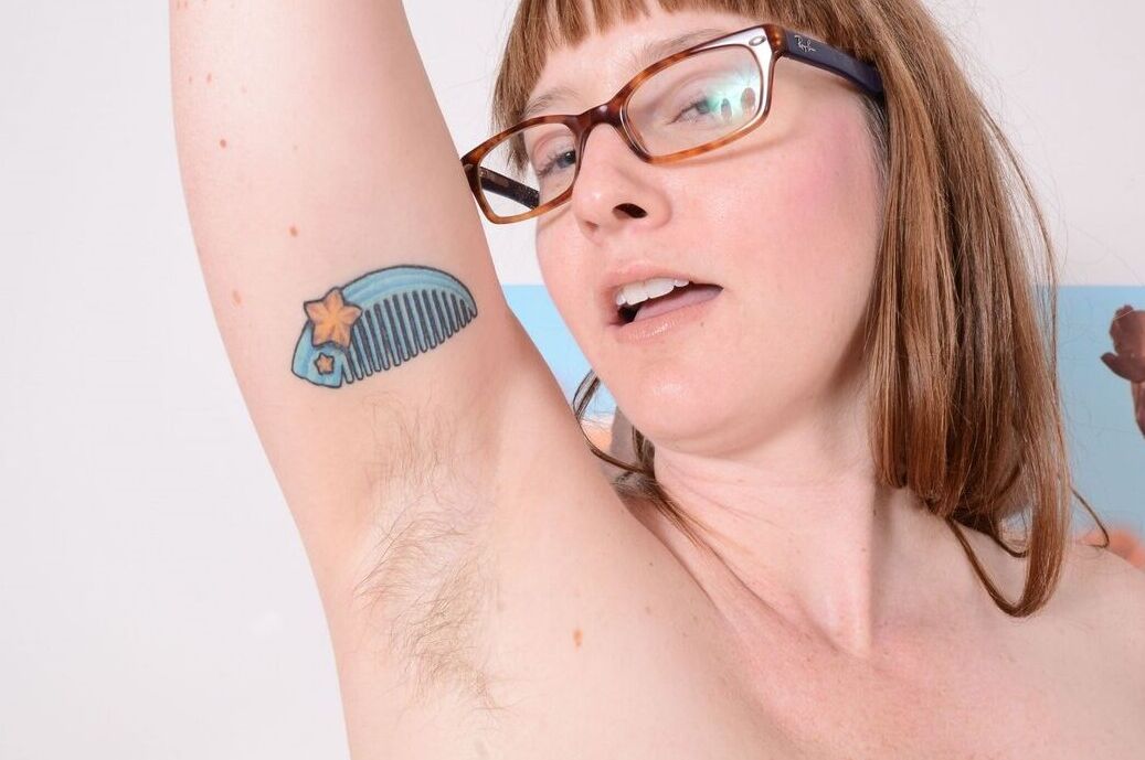 21P Nerdy amateur slut Thelma Sleaze displays her hairy crotch and fuzzy armpits