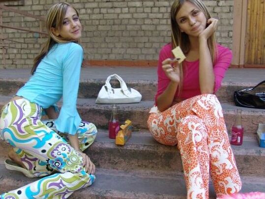 10P Young lesbians Laura & Katrina share an air kiss on the steps of a complex
