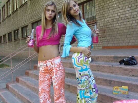 10P Young lesbians Laura & Katrina share an air kiss on the steps of a complex