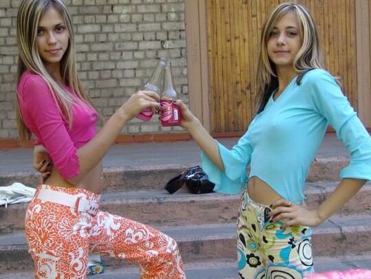 10P Young lesbians Laura & Katrina share an air kiss on the steps of a complex