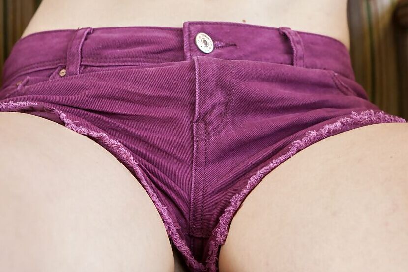 16P Thin amateur girl Poppy B peeling off shorts and panties to pose nude in socks