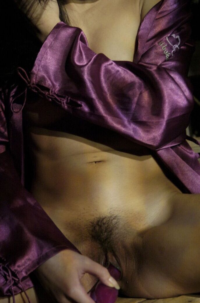 16P The beautiful Asian is having fun with a nice little purple dildo