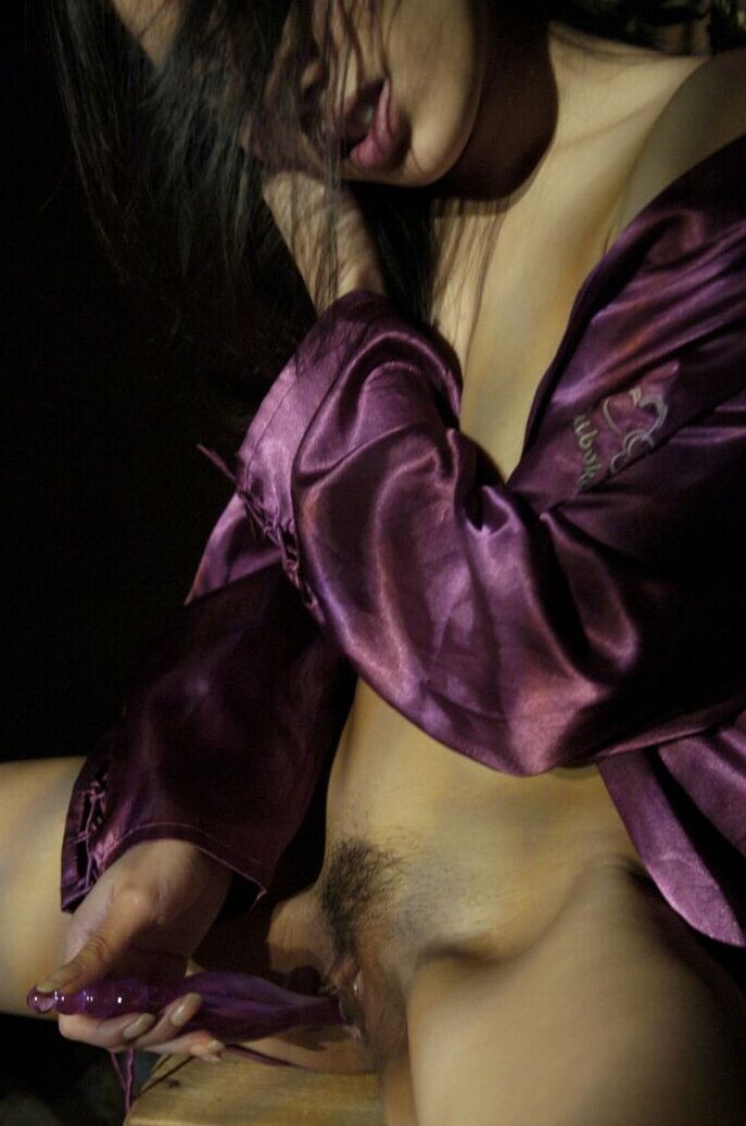 16P The beautiful Asian is having fun with a nice little purple dildo