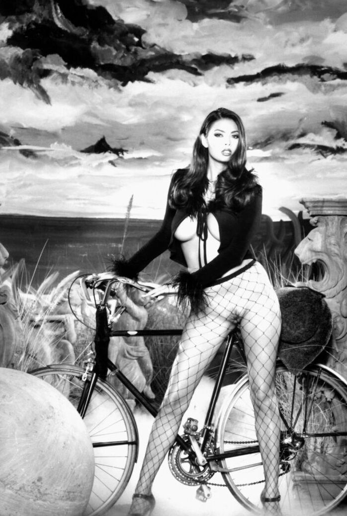 21P Brunette babe with big tits Tera Patrick toys herself in black fishnets