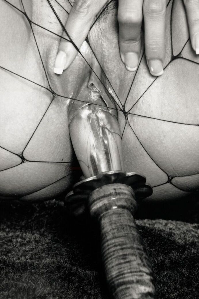 21P Brunette babe with big tits Tera Patrick toys herself in black fishnets
