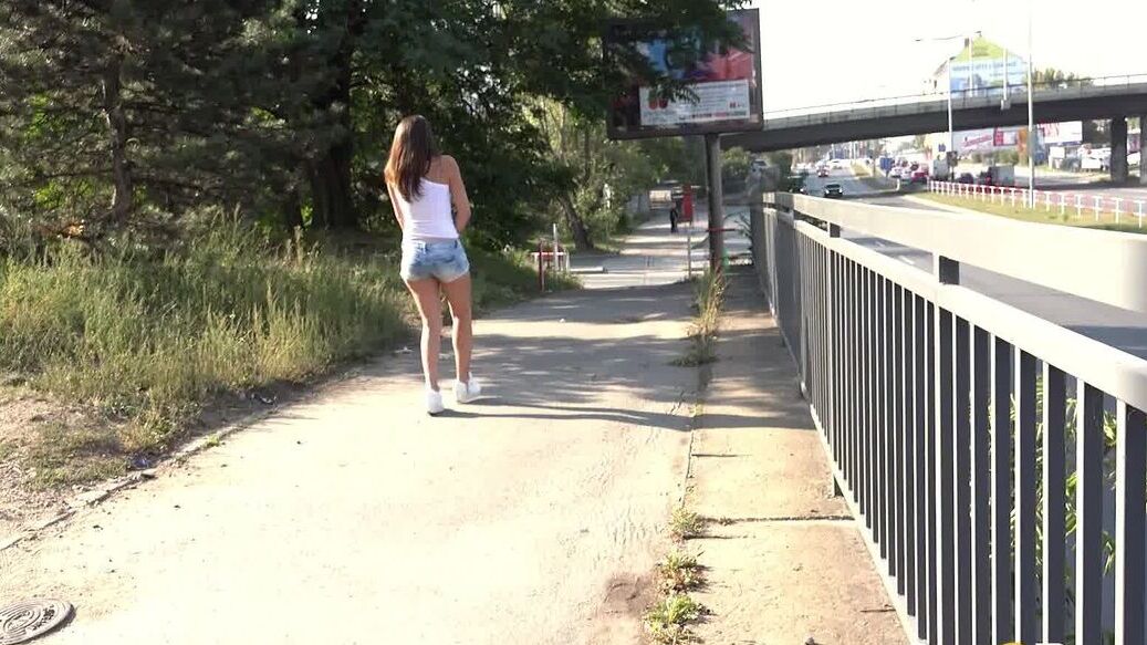 15P Caucasian chick Yenna pulls down her shorts to piss next to a public sidewalk
