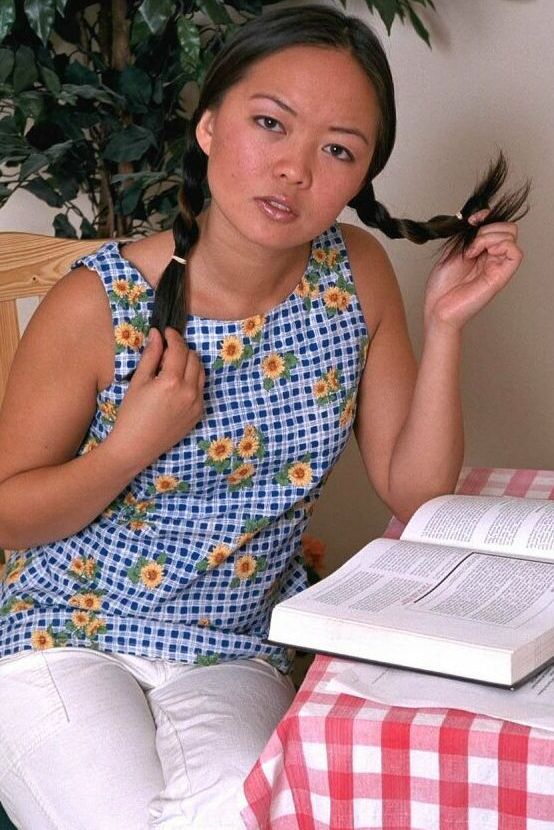 16P Asian first timer Amy undressing to model naked in pigtails on chair