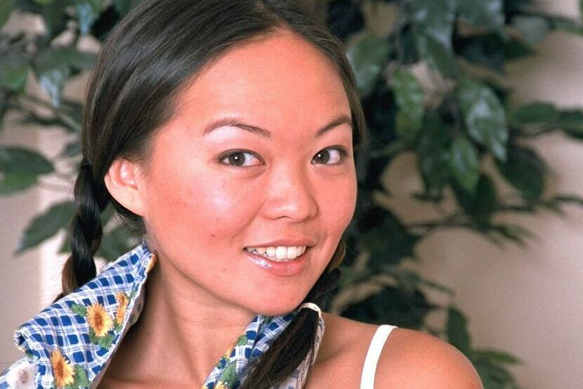 16P Asian first timer Amy undressing to model naked in pigtails on chair