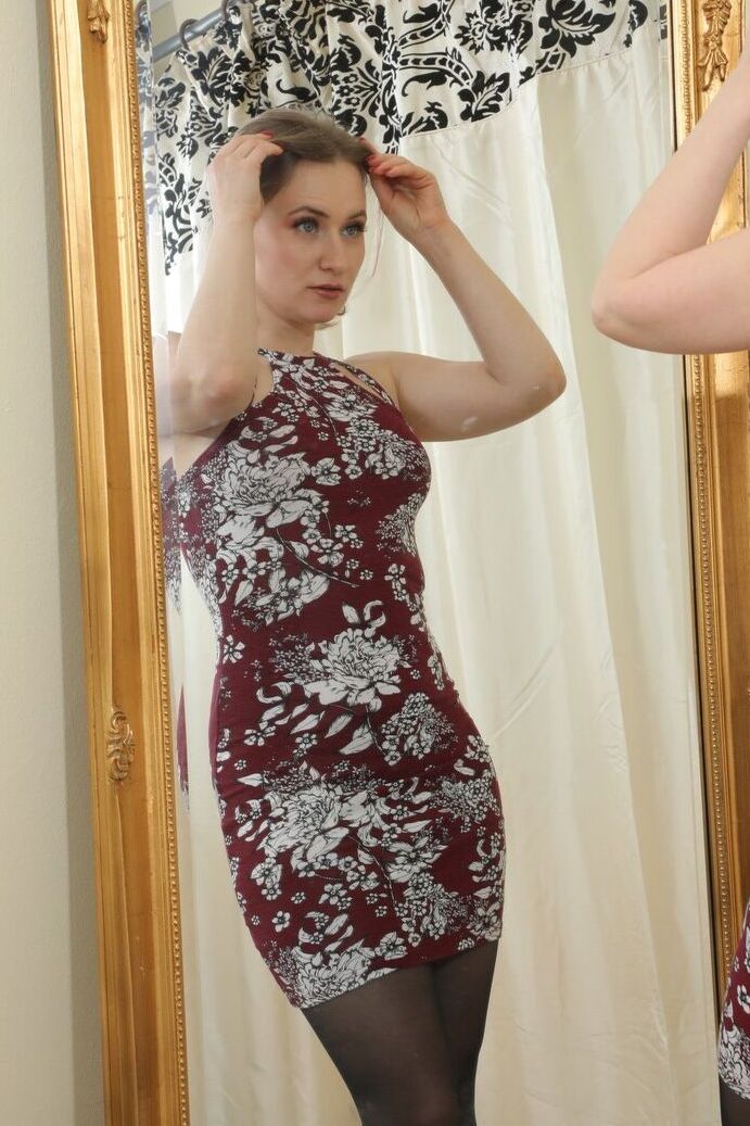 16P Luna from Only Tease in a minidress with high heels and sheer black stockings