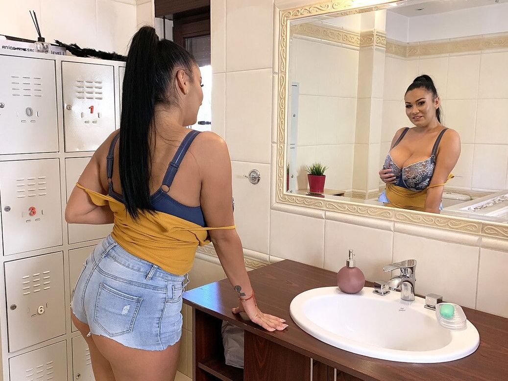 16P Curvy brunette Helen Star uncovers her huge breasts while in a bathroom