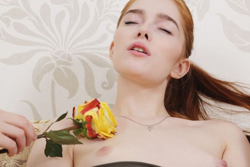 16P Jia is naked on the couch She plays with a yellow rose, sliding it all over