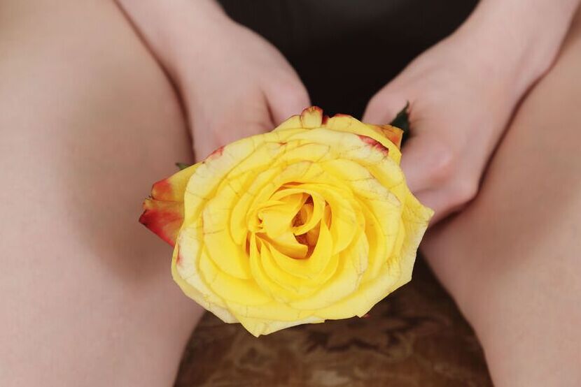 16P Jia is naked on the couch She plays with a yellow rose, sliding it all over