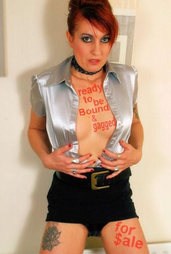 16P Redhead female spends her days gagged and bound in one way or another
