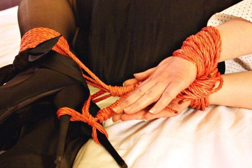16P Natural redhead ends up cleave gagged while hogtied in her clothes on a bed