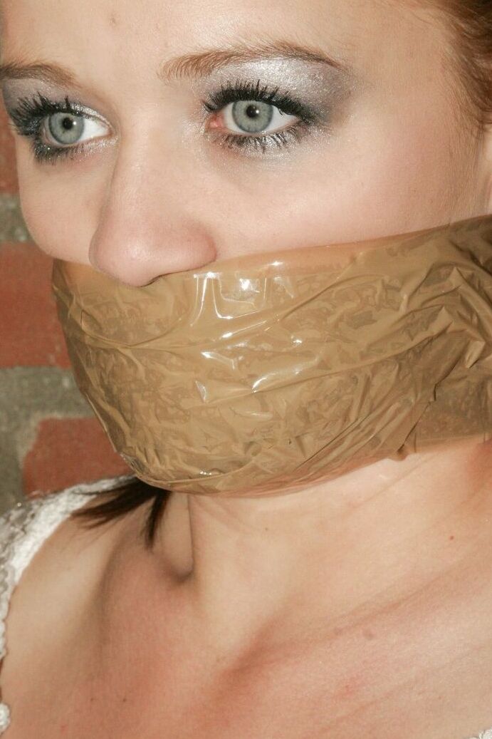 17P Bound and gagged white female has her white legging ripped open