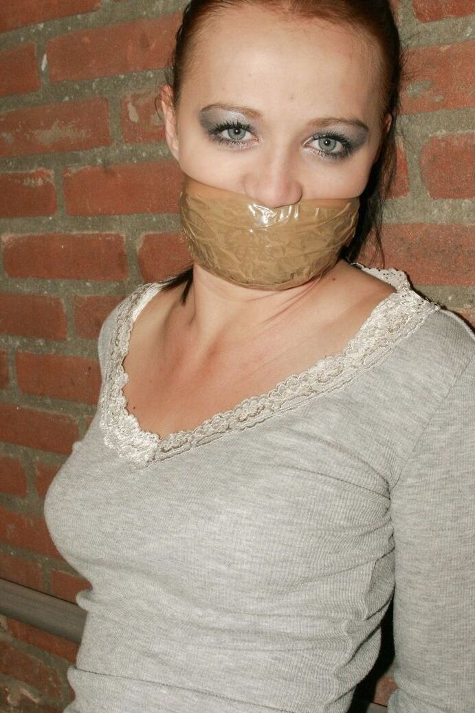 17P Bound and gagged white female has her white legging ripped open