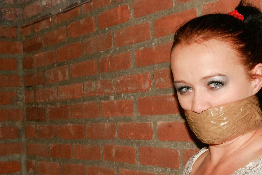 17P Bound and gagged white female has her white legging ripped open