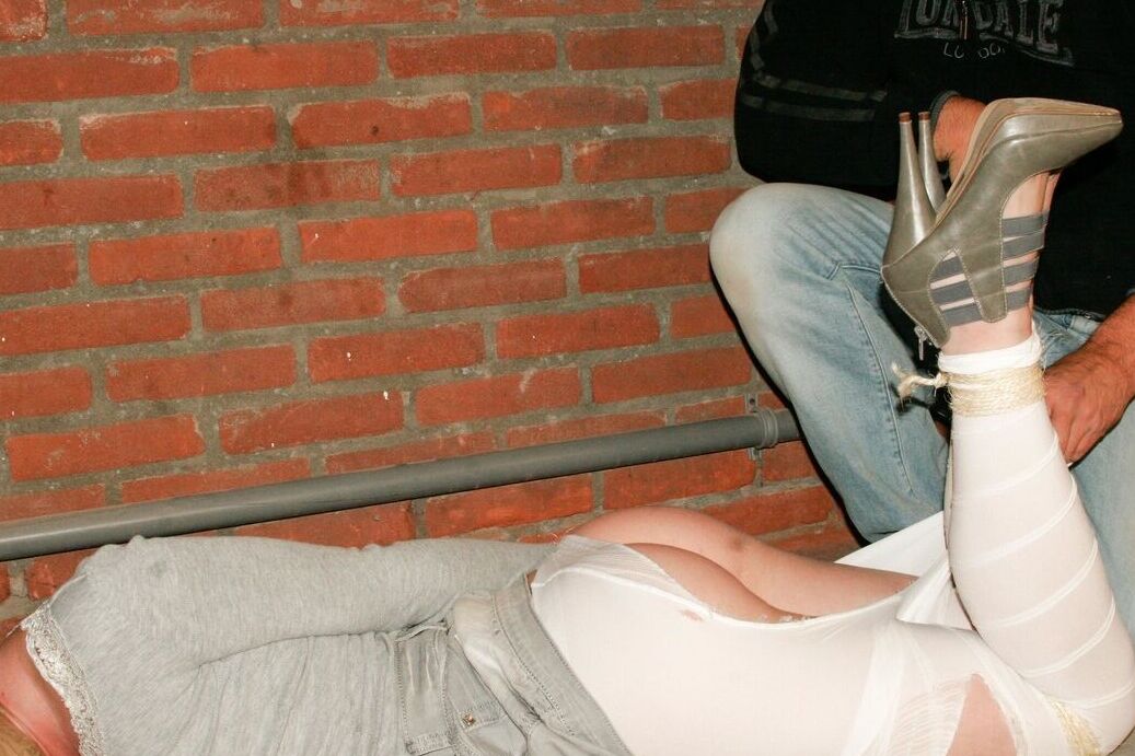 17P Bound and gagged white female has her white legging ripped open