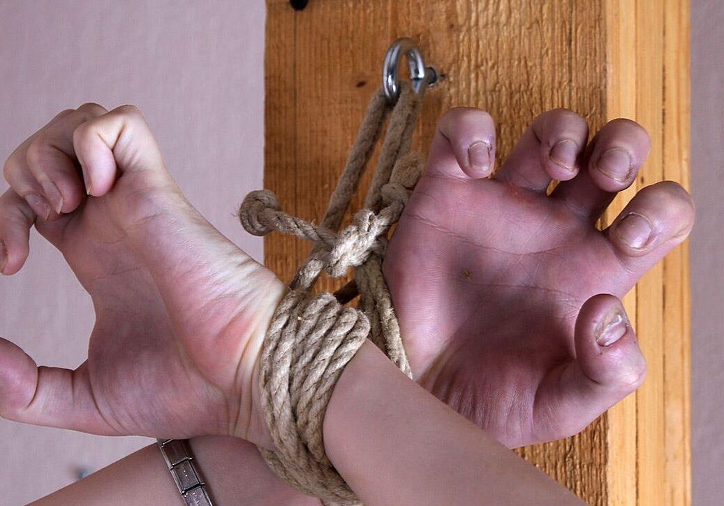 16P Naked brunette Bianca struggles while gagged and affixed to a wooden post