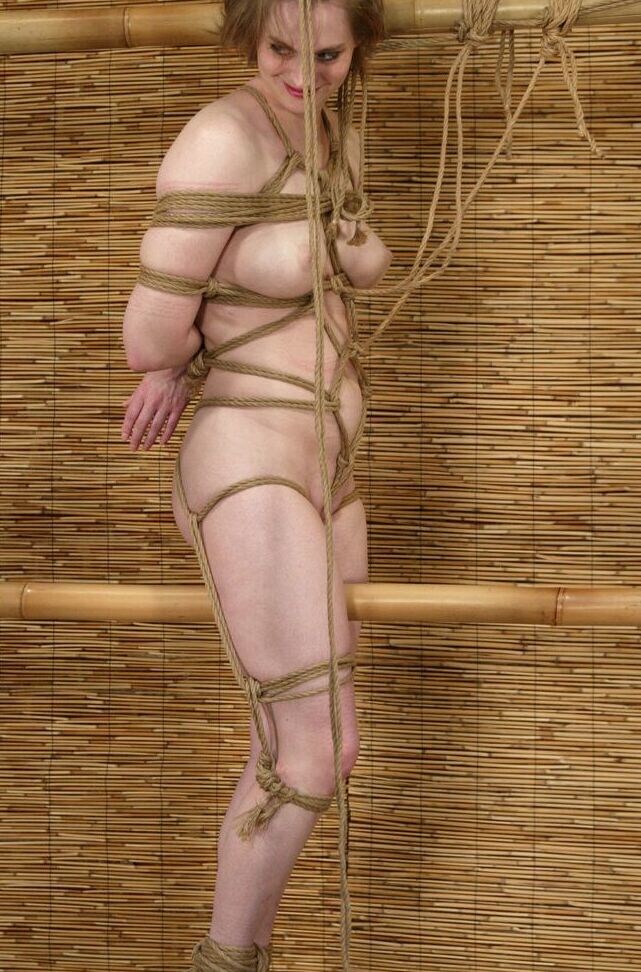 21P Submissive blonde Tracey Hilton gets tied up in rope bondage while fully naked