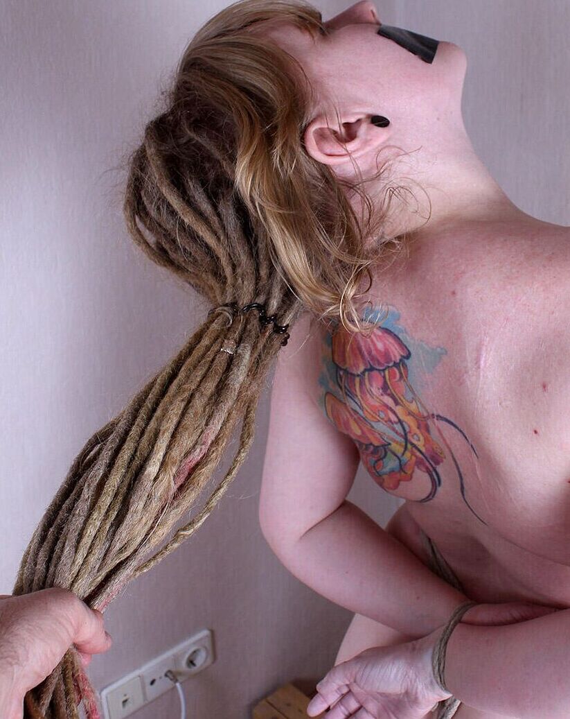 16P Tattooed chick with dreadlocks is silenced with duct tape while tied with rope