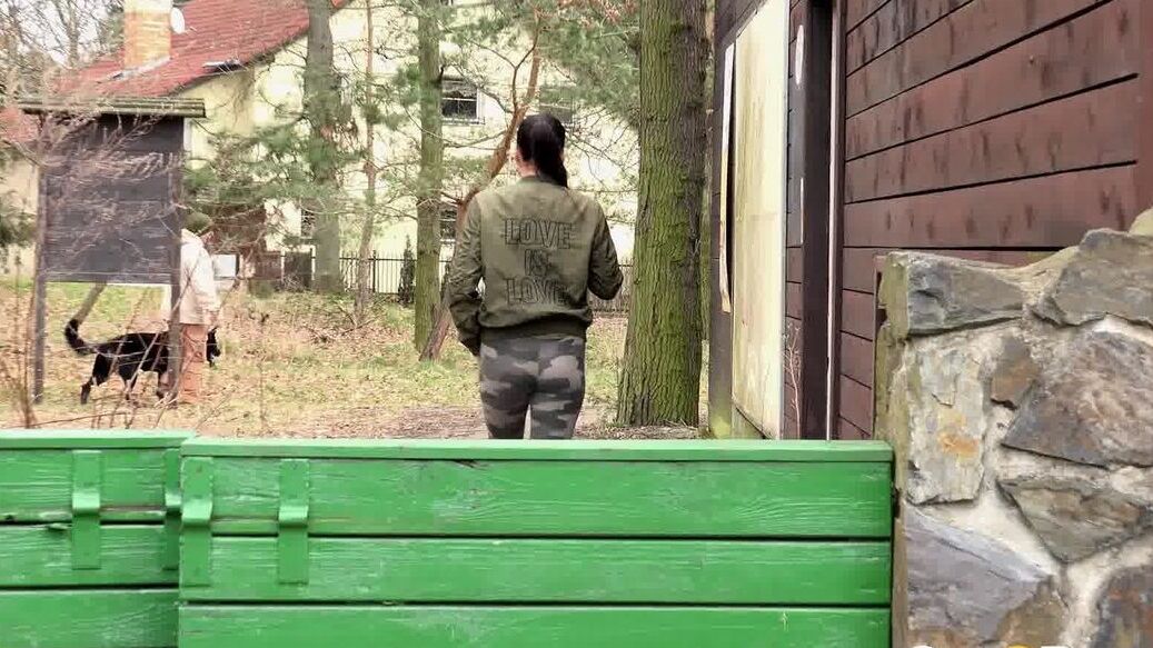 15P Brunette chick Dellai pulls down camo pants for a badly needed pee in public