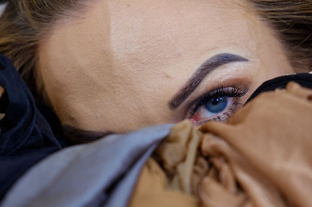 16P Petite girl Vinna Reed covers herself in multiple layers of hose on a bed