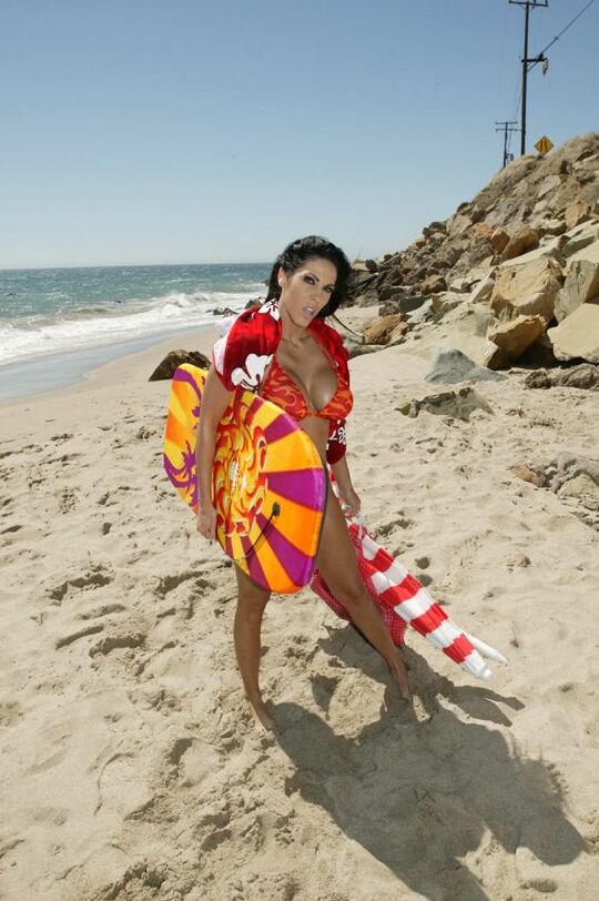 16P Busty MILF Veronica Rayne strips off bikini and posing on the beach
