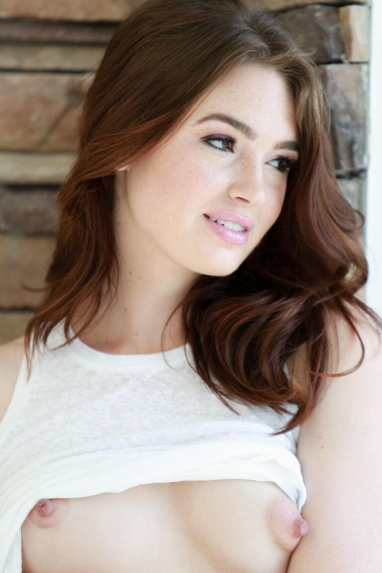 15P Glamorous brunette model Jodi Taylor	shows natural tits and bushy vagina